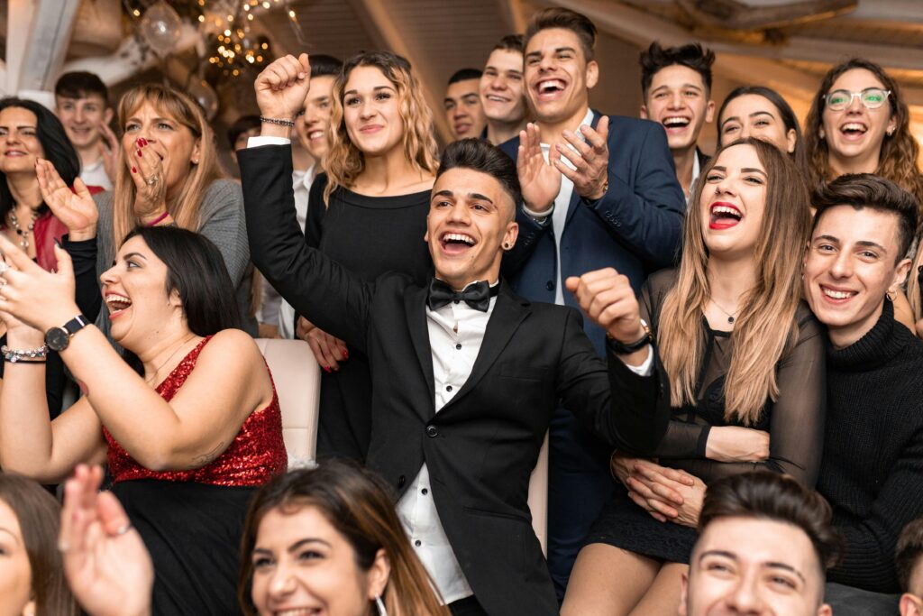 Image of guests laughing out loud representing a comedy roast
